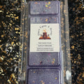 The Femme Fatale fruity floral bookish soy vegan wax melt in a front-facing clamshell showing the Once Upon a Scent label, hand-poured in Yorkshire.