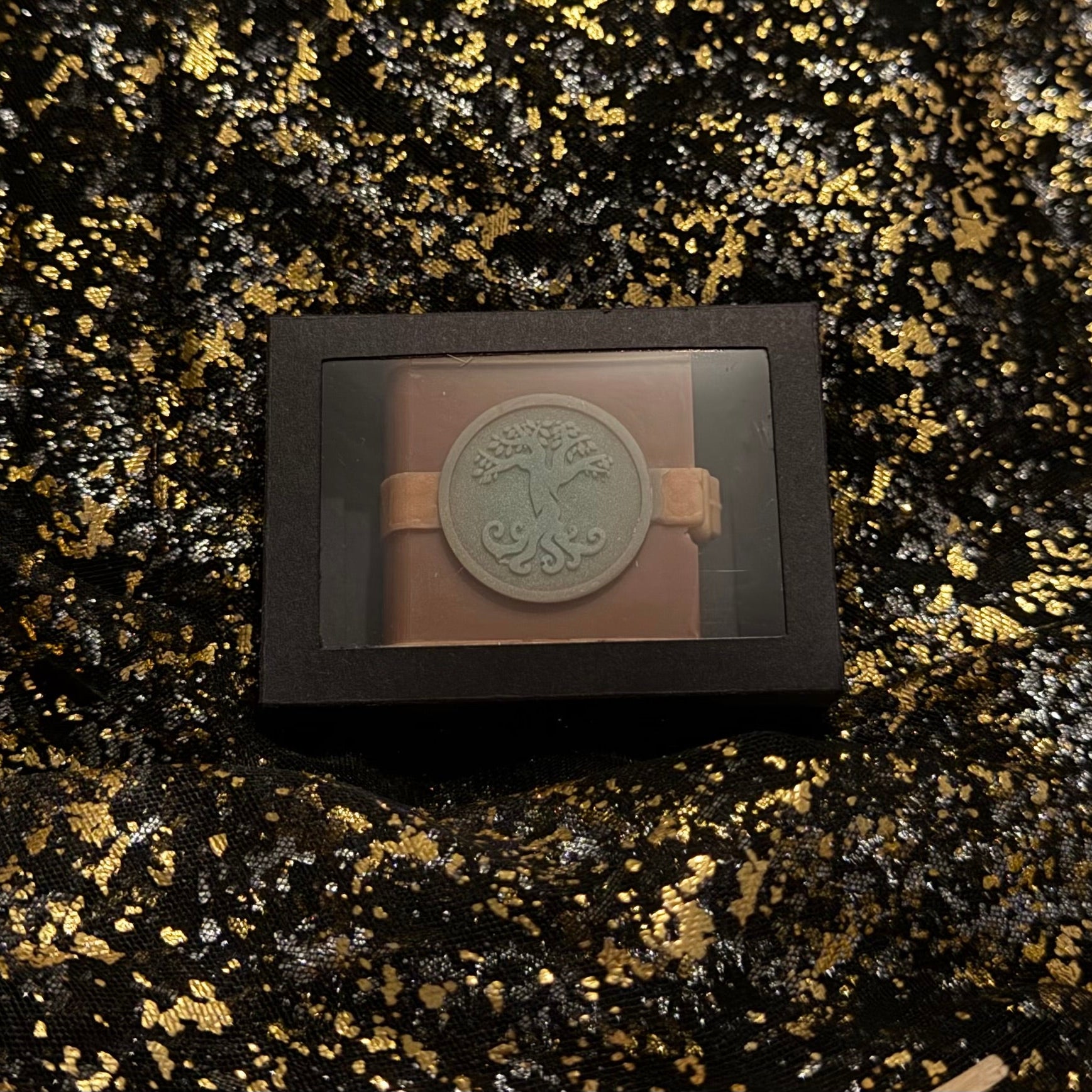 Zodiac Academy Earth Element House Terra wax melt in black gift box with tree embossed spell book design on gold glitter background