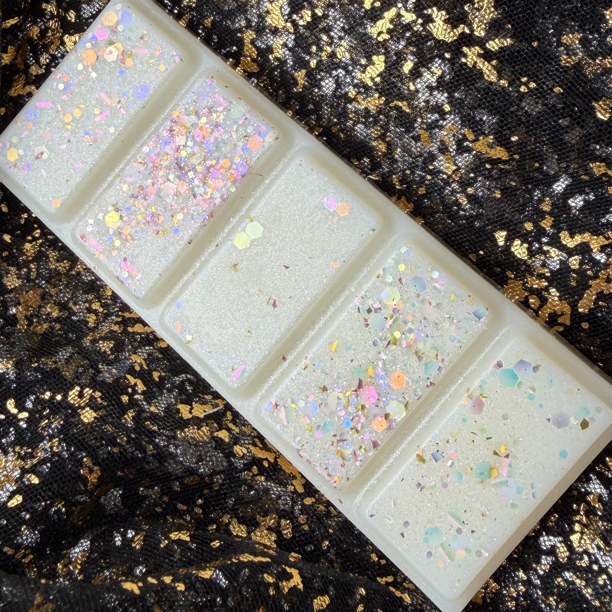 Full five-segment Baby Mine baby powder soy wax melt with a white finish and sparkling iridescent decoration.