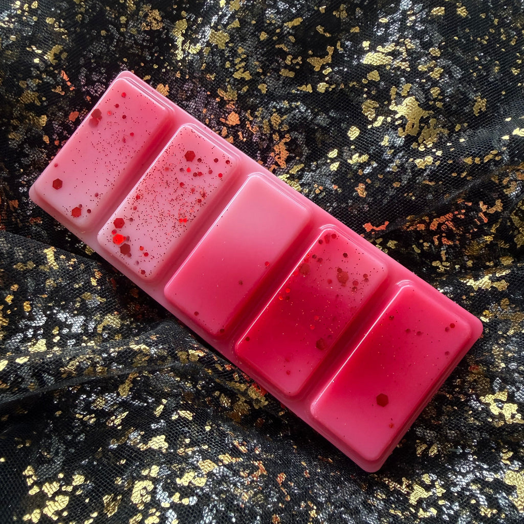 Red and white five-segment Fated Mates bookish wax melt with red decorative detailing, handmade using soy wax.