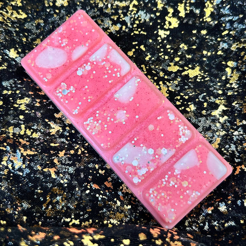 Candy Cane festive soy wax melt clamshell positioned sideways showing decorative design with white stripe and glitter, long-lasting Christmas home fragrance