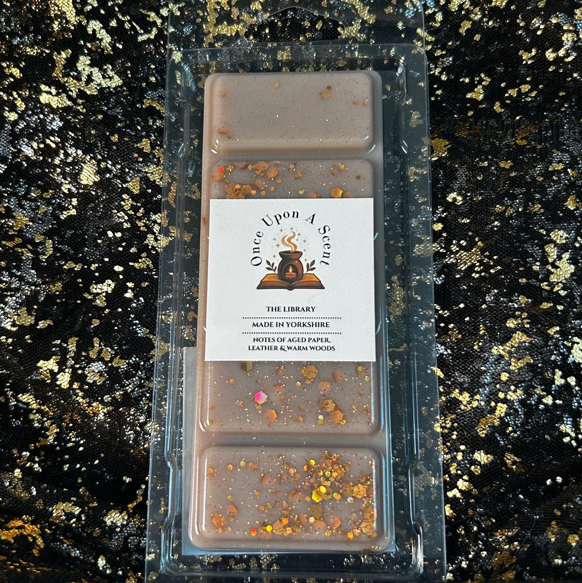 Front-facing clamshell of The Library book-inspired soy wax melts, hand-poured in Yorkshire, showing the Once Upon a Scent label